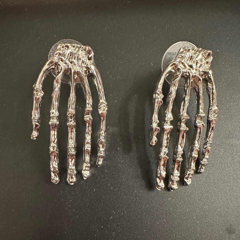 Skeleton Earrings “getting handsy” from Post